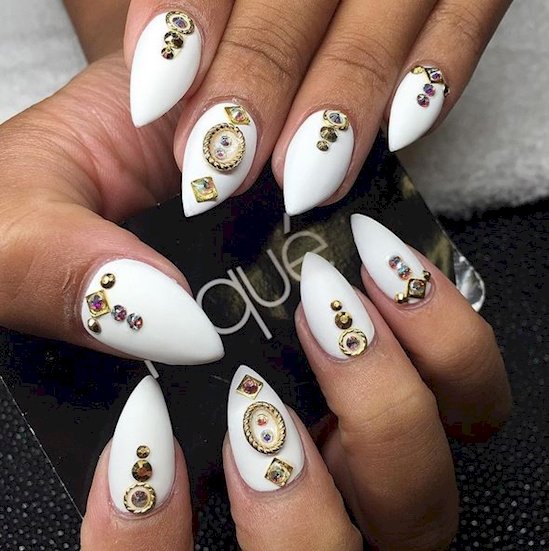 1. The look of a white manicure totally changes by simply adding gold accents.