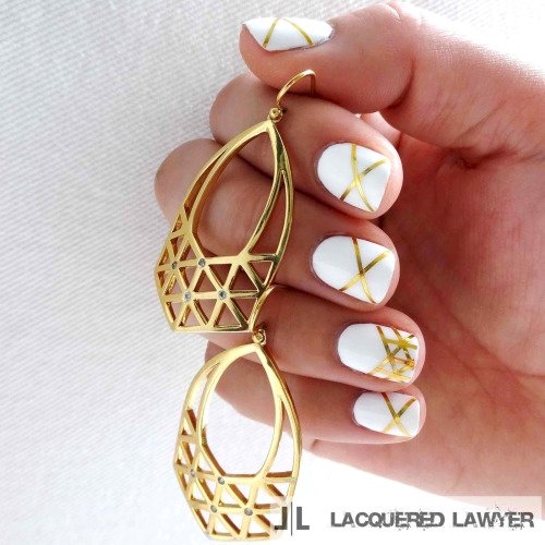 5. Gold stripping tape is the perfect way to add some glam to plain white nails.