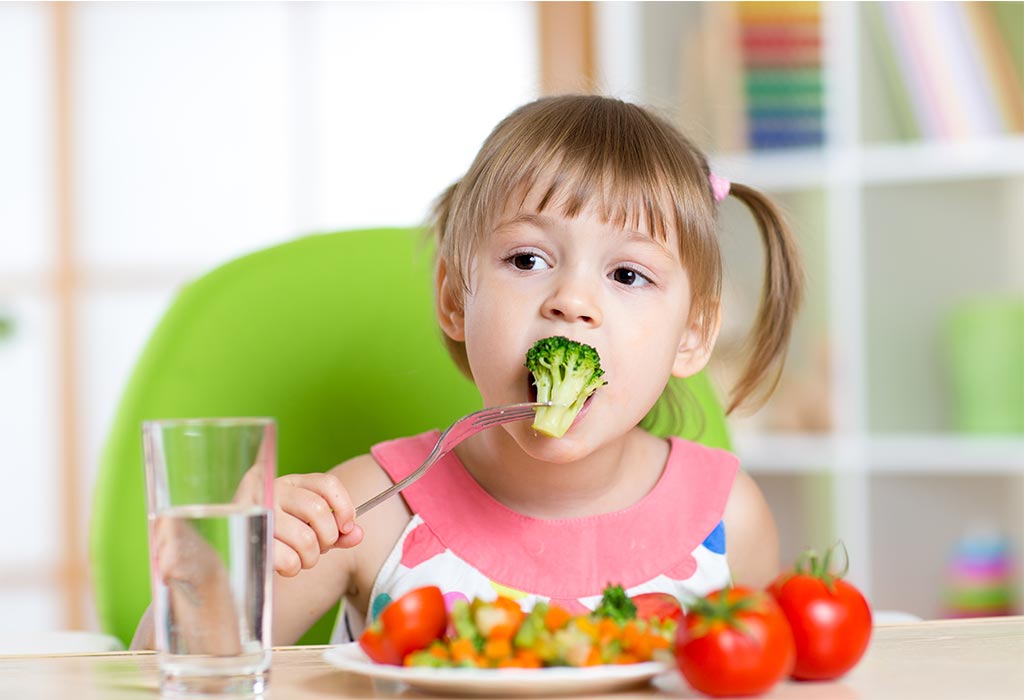 girl eating veggies
